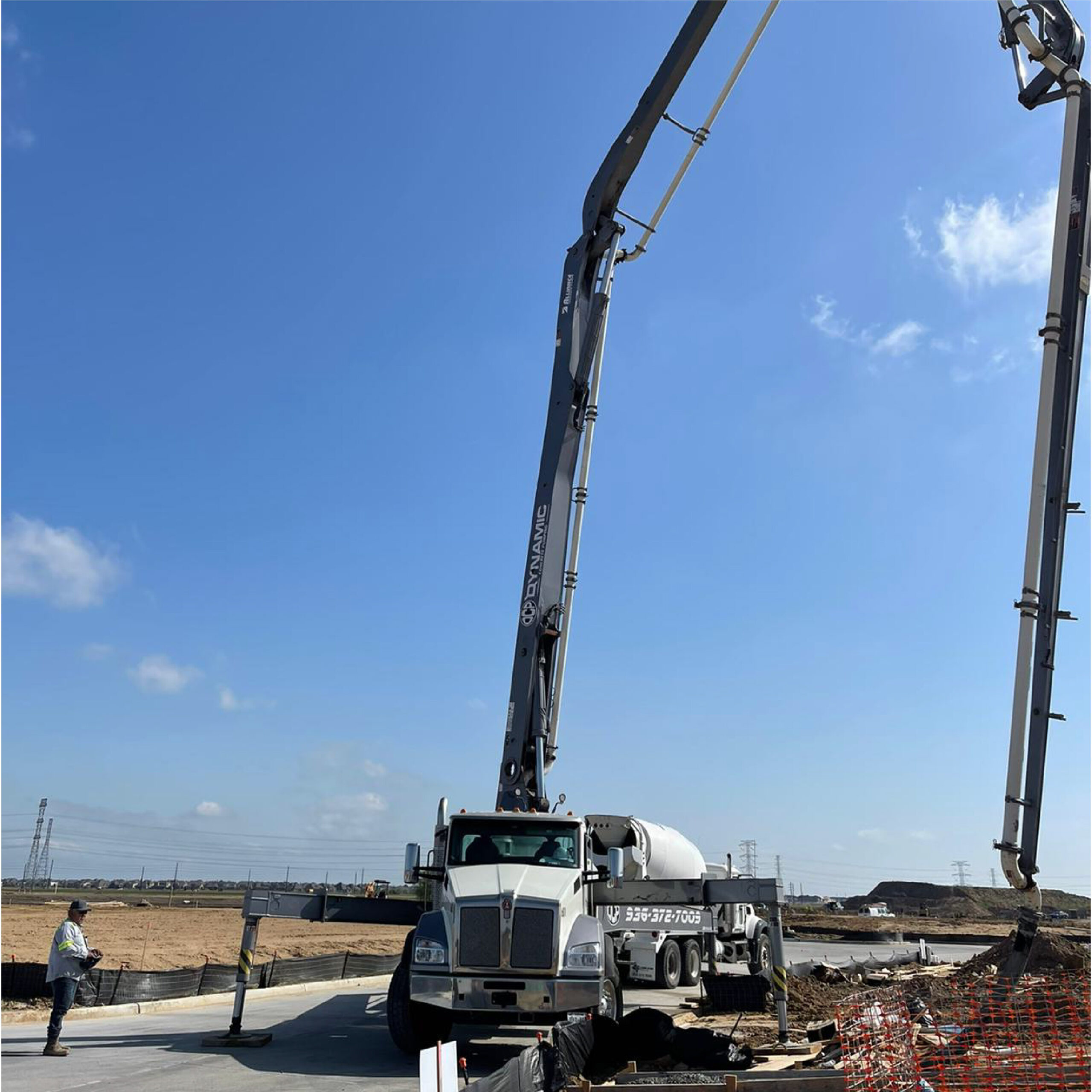 Boom pump and ready-mix truck working a pour